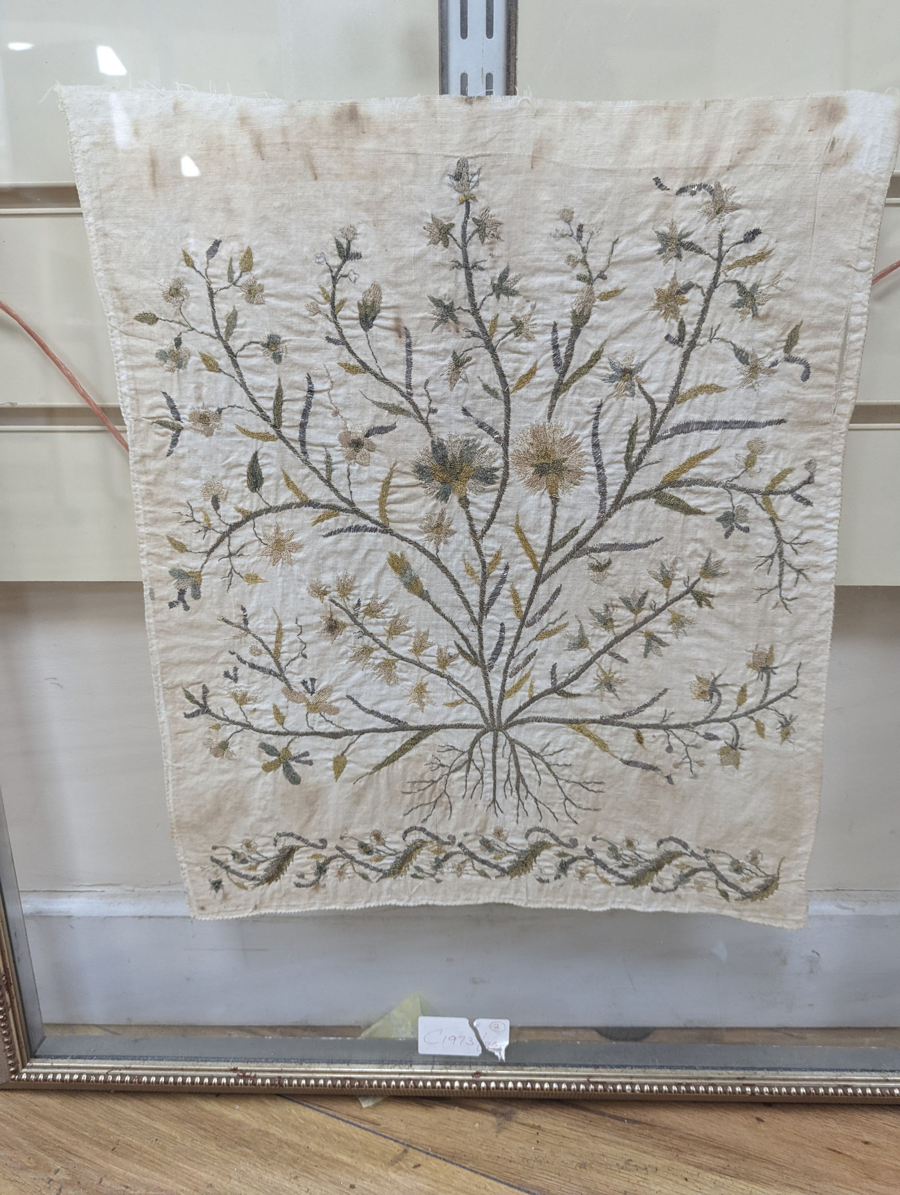 A pair of framed, silver and gold thread floral embroidered Turkish towel ends, 39 x 35cm excl. frame.